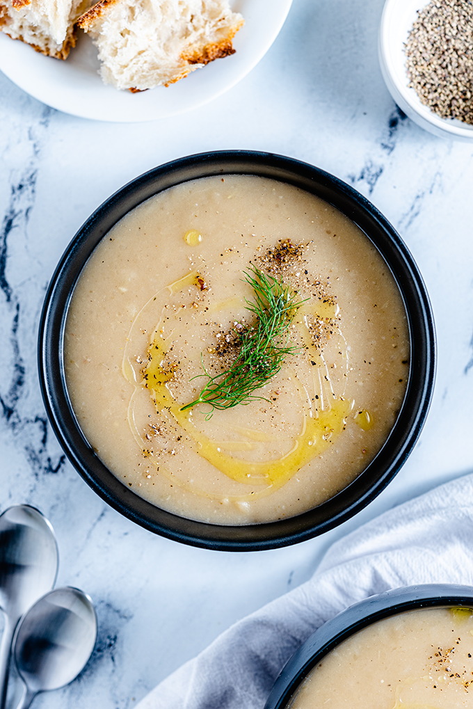 Roasted Fennel and Potato Soup overhead with bread and pepper